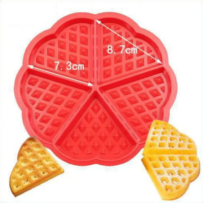 Red silicone mold with 5 cavities for heart-shaped waffles, each cavity measuring 7.3 cm by 8.7 cm, displayed with two heart-shaped waffles. Perfect for baking evenly shaped waffle portions.